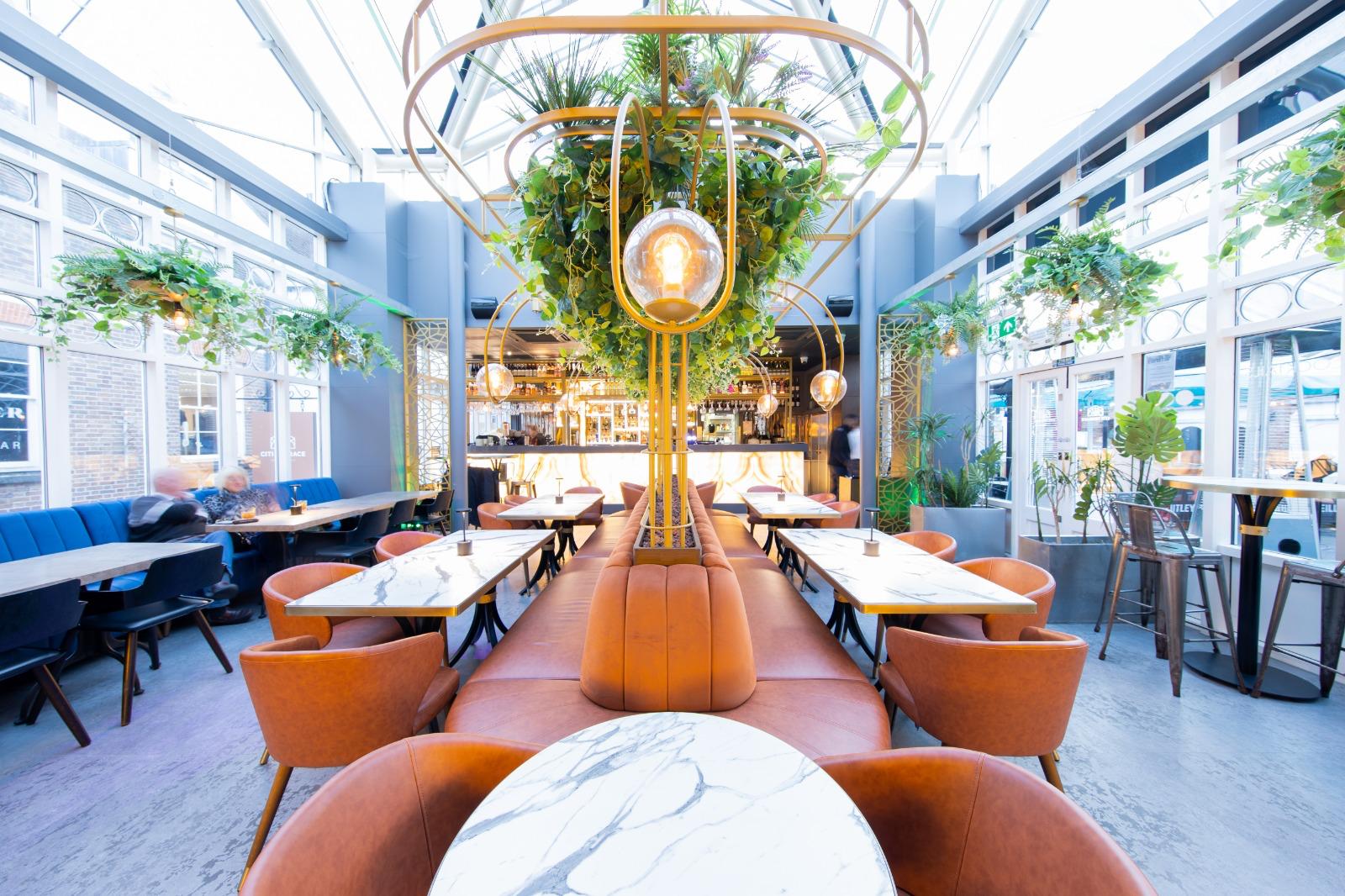 Inside the plant-filled dining room and bar at Citi Terrace